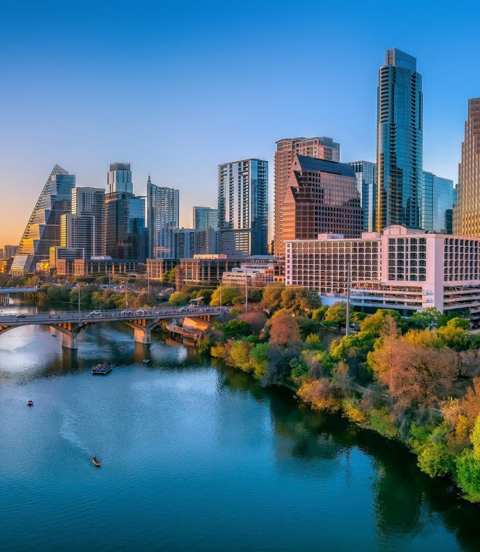 Downtown Austin skyline above Lady Bird Lake at golden hour